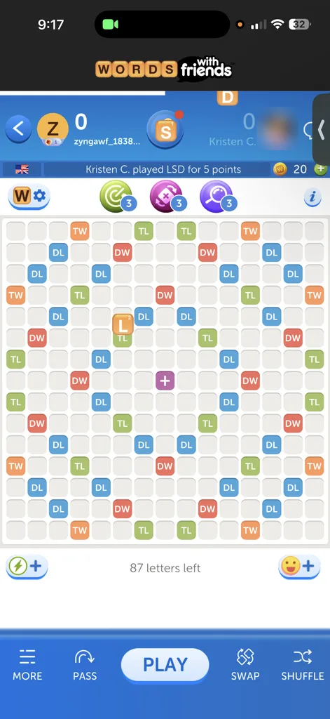 The game board with the opponent's first word already played and three boost icons with badges